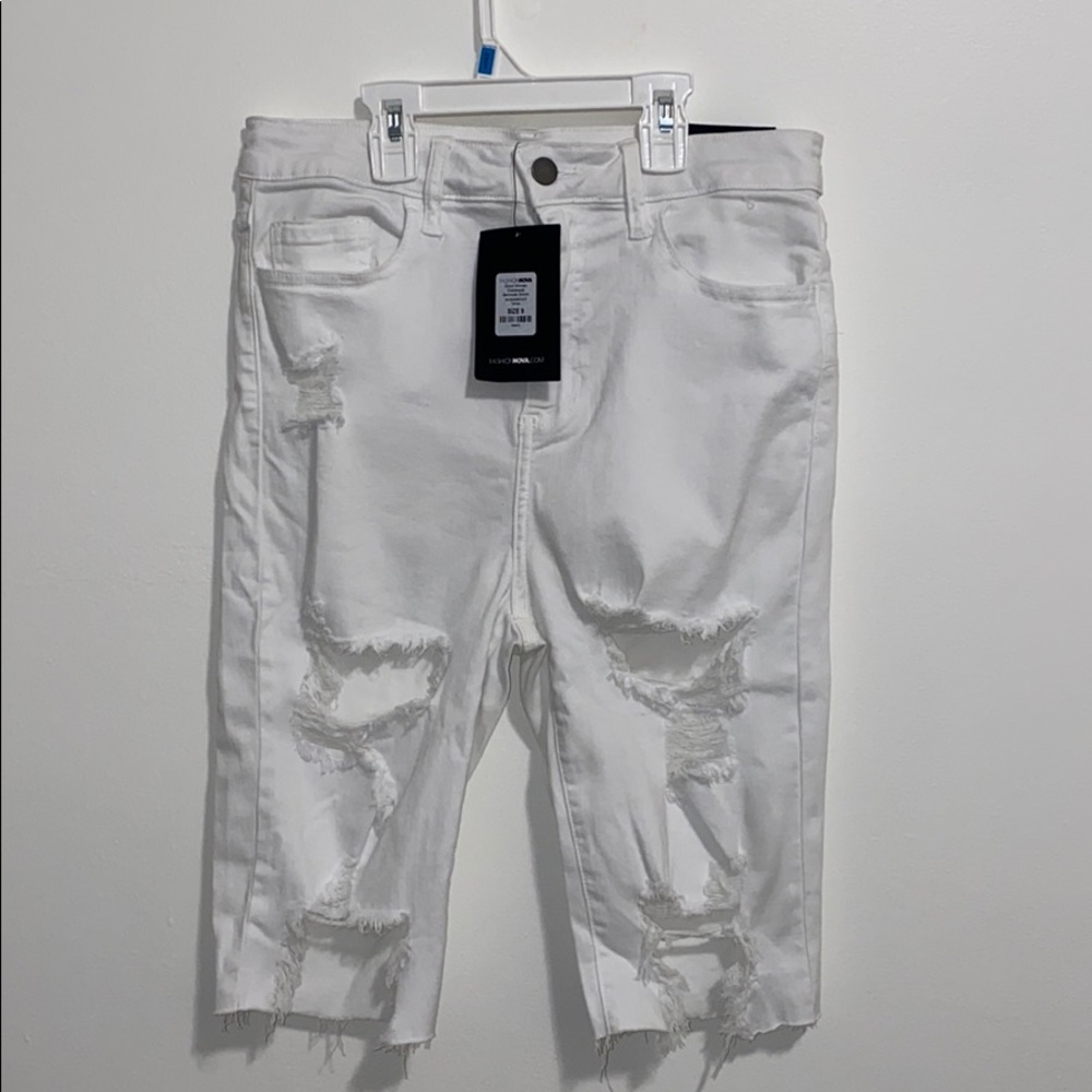 Thigh length ripped shorts